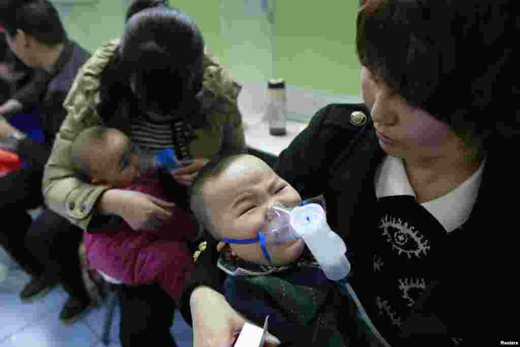 Children with respiratory illness receive treatment at a hospital in Beijing, Feb. 21, 2014. 