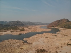 Farmers near Nong Khai, Thailand, rely on the river to irrigate crops, especially during the dry season. Lately, said Sanit Khun, the river level has sometimes dropped to less than half what it was. (Steve Sandford/VOA)