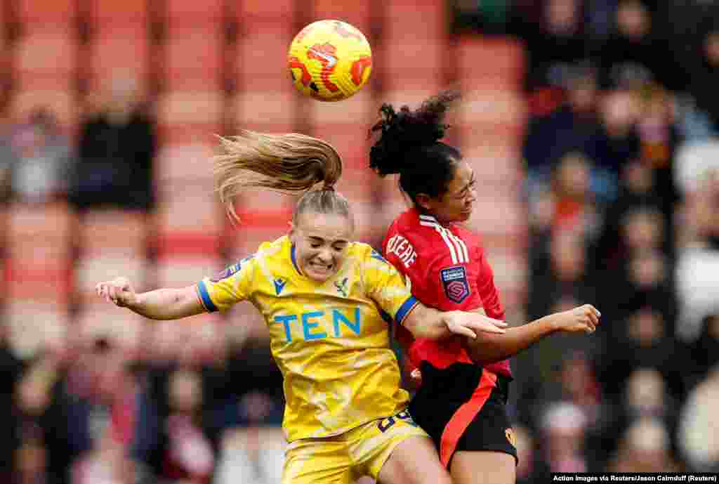 Crystal Palace's Lily Woodham and Manchester United's Jayde Riviere fight for the ball during the Women's Super League football match between Manchester United and Crystal Palace at Leigh Sports Village in Leigh, Britain.