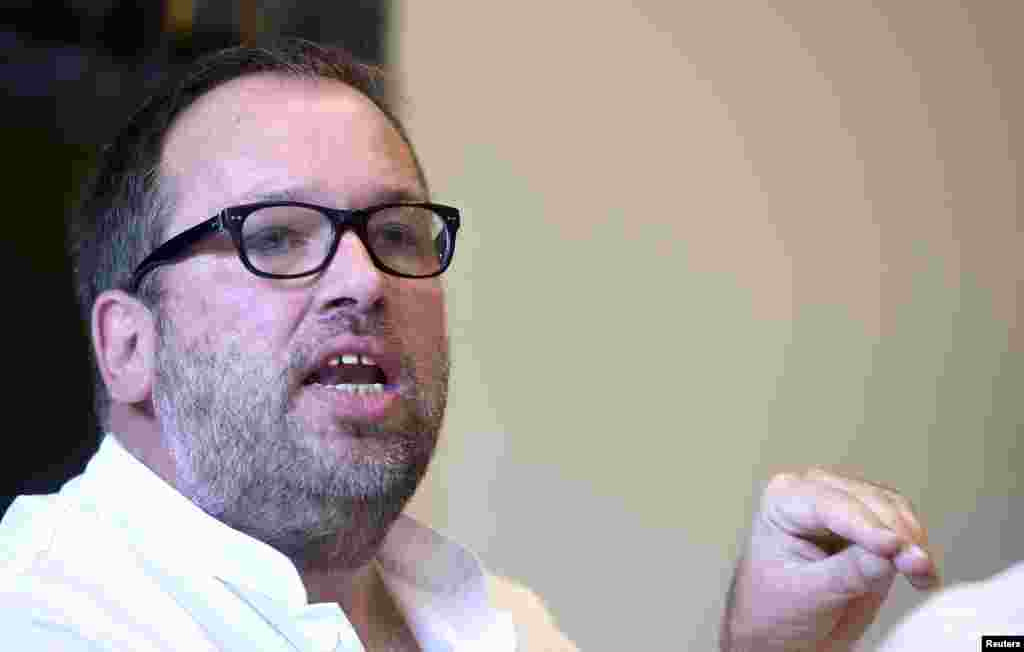 Doctor Stefan Schmiedel of the 'Universitaetsklinikum Hamburg-Eppendorf ' (University Clinic Eppendorf- UKE) addresses the media after an employee of the World Health Organisation (WHO) arrived at the hospital in Hamburg, Aug. 27, 2014