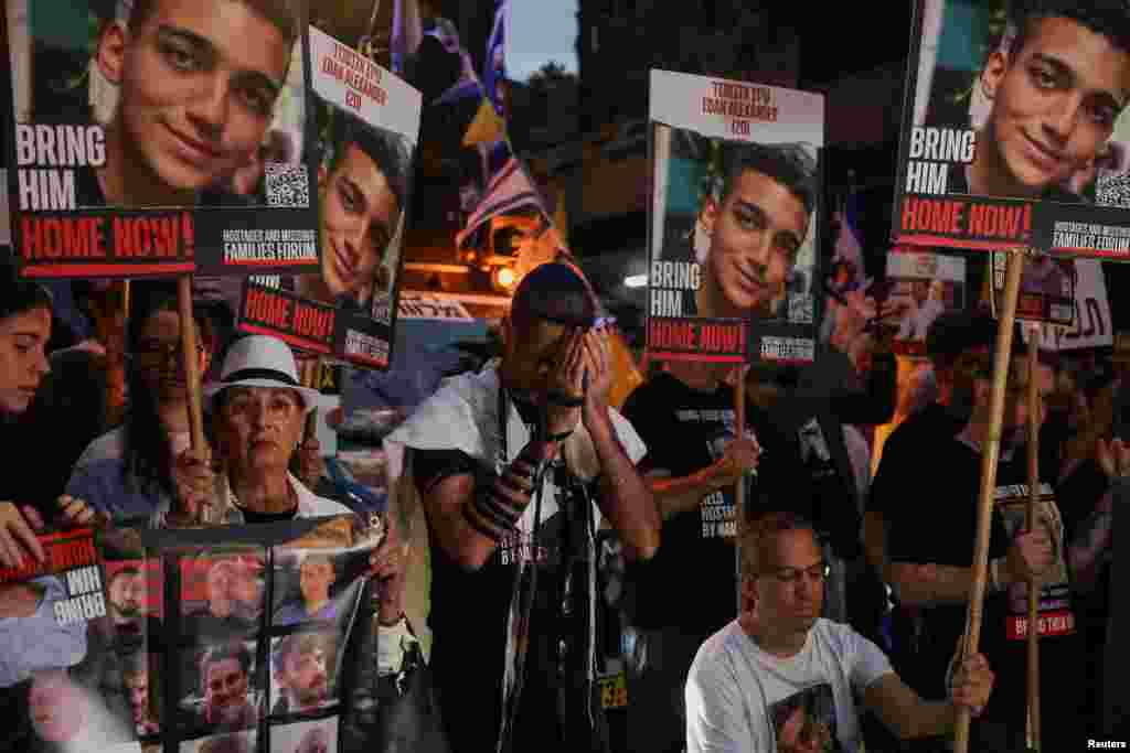Protesters march towards Israeli Prime Minister Benjamin Netanyahu's private residence to mark one year since the deadly October 7 attack by Hamas, in Jerusalem.