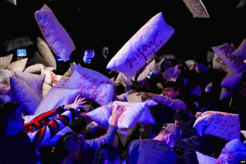Chinese residents take part in a 'Pillow Fight Night' during an event to mark Christmas eve in Shanghai.