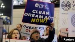 FILE - Activists demonstrate outside the New York office of Sen. Chuck Schumer in New York to ask for the passage of a 'clean' Dream Act, one without additional enforcement or security, Jan. 10, 2018.