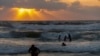 Families gather on the beaches of Alexandria, Egypt, on July 25, 2021. (Hamada Elrasam/VOA) 