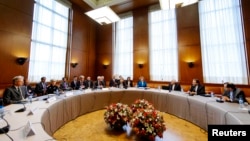 Delegations from Iran, other countries at start of two days of closed-door nuclear talks, United Nations offices, Geneva, Oct. 15, 2013.
