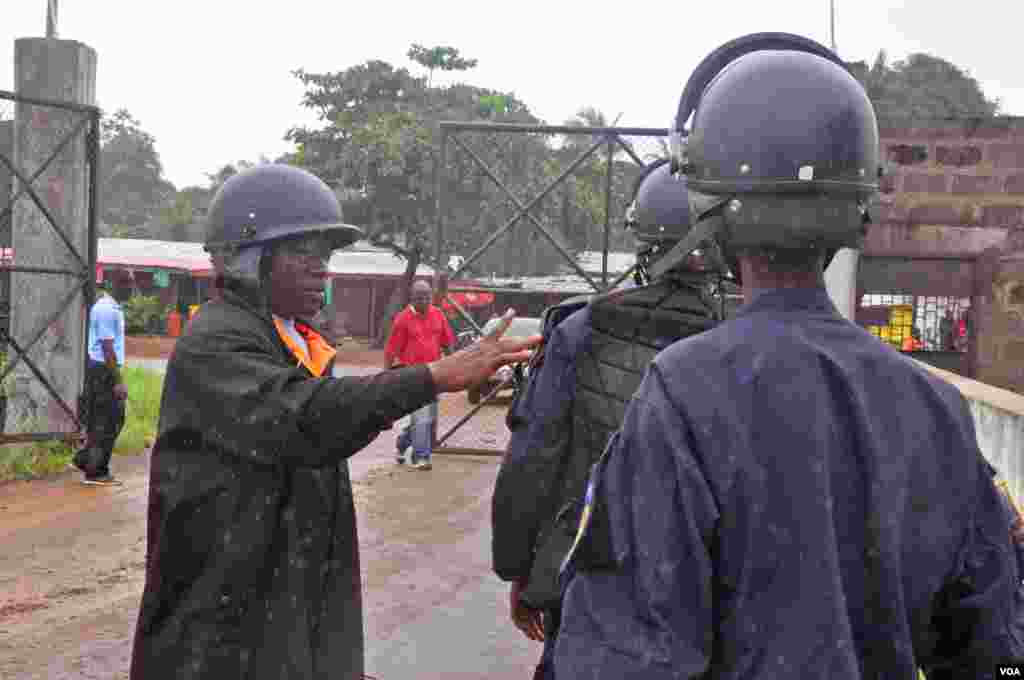 Liberian police are deployed at an Ebola treatment center to provide security, Monrovia, Liberia, Aug. 18, 2014. 