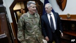 U.S. Defense Secretary James Mattis, right, and U.S. Army General John Nicholson, left, commander of U.S. Forces Afghanistan, arrive to meet with an Afghan defense delegation in Kabul Afghanistan, April 24, 2017. 