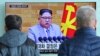 People watch a TV screen showing North Korean leader Kim Jong Un's New Year's speech, at Seoul Railway Station in Seoul, South Korea, Jan. 3, 2018. North and South Korea agreed Friday to revive their formal dialogue.