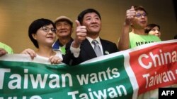 台灣衛生福利部部長陳時中（中）率團到日內瓦在世界衛生大會的場外發聲。 （2018年5月21日）