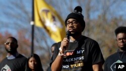 Jonathan Butler addresses a crowd following the announcement University of Missouri President Tim Wolfe would resign. Butler has ended his hunger strike as a result of the resignation. (AP Photo/Jeff Roberson)