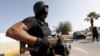 A member of the force assigned to protect Libya's unity government stands at the entrance to where the government has its offices, in Tripoli, Libya, April 14, 2016.