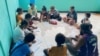 FILE - Anak-anak Papua belajar bersama guru relawan dari Gerakan Papua Mengajar. (Foto: Courtesy/Agus Kadepa GPM)