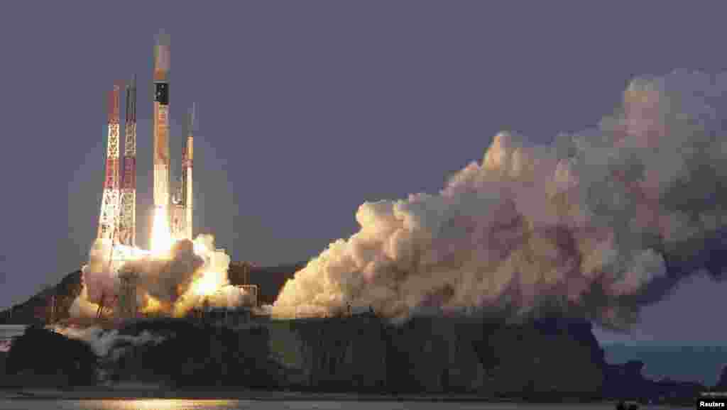 A H-IIA rocket, carrying X-ray astronomy satellite "ASTRO-H", lifts off from the launch pad at Tanegashima Space Center on the Japanese southwestern island of Tanegashima, in this photo taken by Kyodo.
