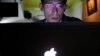 Vietnamese Internet activist Nguyen Lan Thang chats on Facebook at a cafe in Hanoi, Nov. 27, 2013.