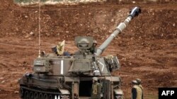 An Israeli army mobile artillery cannon is stationed near the border with Syria in the Israeli-occupied Golan Heights, Jan. 27, 2015. 