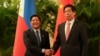 Philippines President Ferdinand "Bongbong" Marcos Jr., shakes hands with China's National People's Congress (NPC) Standing Committee Chairman Li Zhanshu at the Great Hall of the People in Beijing, China, Jan. 4, 2023. 
