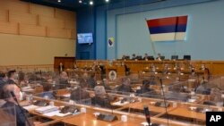 FILE - Bosnian Serb's lawmakers take part in the parliament session in Banja Luka, Dec. 10, 2021. Lawmakers, Dec. 25, 2024, ordered Serb representatives in state institutions to block decision-making and reform laws needed for the Balkan country's integration into the EU. 
