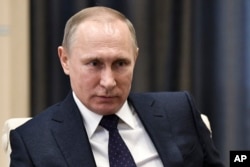 FILE - Russian President Vladimir Putin takes part in a meeting in Moscow.
