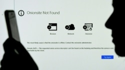 This photo illustration shows a screen displaying the Darkside onionsite address with a notice saying it could not be found, in Arlington, Virginia on May 14, 2021. (AFP)