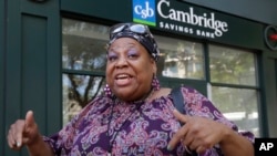 Maribel Ortiz, of Cambridge, Mass., speaks in reaction to President Trump's tweets ordering American congresswomen of color to go back to where they came from, July 15, 2019. 