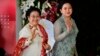 Ketua Umum PDI-P Megawati Sukarnoputri dan putrinya, Puan Maharani, yang saat itu menjabat Menko Pembangunan Manusia dan Budaya, menghadiri pelantikan Presiden Joko Widodo di Gedung DPR/MPR, 20 Oktober 2019. (Foto: Adek Berry/Pool Photo via AP)