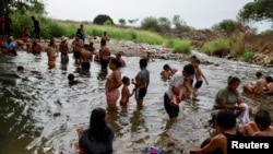 Migrants traveling in a caravan to reach the US border through Mexico rest in Mapastepec, Mexico, Dec. 29, 2023.