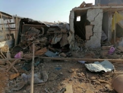 The headquarters of Kataeb Hezbollah, or Hezbollah Brigades militia, lies in ruins in the aftermath of a U.S. airstrike in Qaim, Iraq, Dec. 30, 2019.