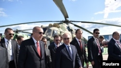 Russian President Vladimir Putin and his Turkish counterpart Recep Tayyip Erdogan visit the MAKS 2019 air show in Zhukovsky, outside Moscow, Russia, Aug. 27, 2019.