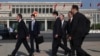 Menteri Luar Negeri Amerika Serikat Antony Blinken (kiri) berjalan bersama para stafnya saat tiba di Beijing, Minggu, 18 Juni 2023. (Foto: Leah Millis/Pool Photo via AP)