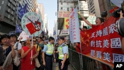 Pro-democracy protesters mark China's National Day, in Hong Kong, Monday, Oct. 1, 2018. (AP Photo/Kin Cheung)