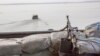 Une mitrailleuse sur un bateau au large de la côte atlantique, au Nigeria, le 19 décembre 2013.