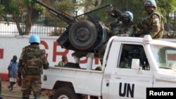 FILE - U.N. peacekeepers patrol a street in Bangui, the capital of Central African Republic, Dec. 30, 2015. A U.N. contingent was sent home in early 2016 from the Central African Republic following allegations of abuse.