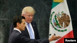U.S. Republican presidential nominee Donald Trump and Mexico's President Enrique Pena Nieto arrive for a press conference at the Los Pinos residence in Mexico City, Mexico, Aug. 31, 2016. REUTERS/Henry Romero 