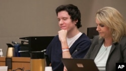 FILE - Defendant John Earnest reacts during testimony by witness Oscar Stewart during Earnest's preliminary hearing, Sept. 19, 2019, in Superior Court in San Diego. 