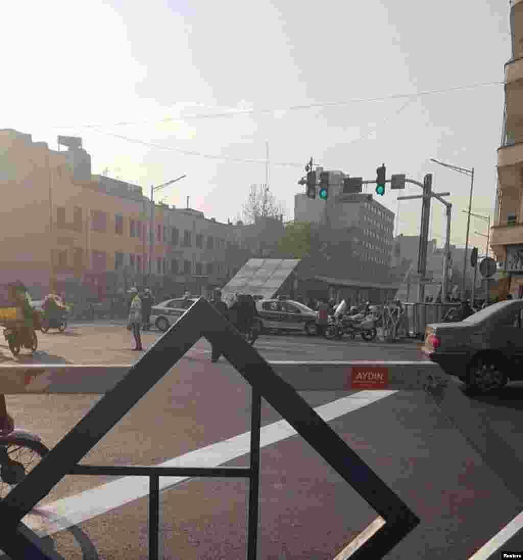 Police vehicles are seen during a protest near the university of Tehran, Iran, Dec. 30, 2017, in this picture obtained from social media.