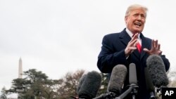 FILE - President Donald Trump speaks to reporters before boarding Marine One on the South Lawn of the White House in Washington, Nov. 26, 2018.