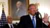 U.S. Vice President Mike Pence listens as U.S. President Donald Trump announces that the United States recognizes Jerusalem as the capital of Israel and will move its embassy there, during an address from the White House, Dec. 6, 2017.