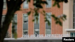 FILE - Signage is seen outside of the Food and Drug Administration (FDA) headquarters in White Oak, Maryland, August 29, 2020.