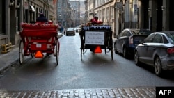 Calèches dans une rue du Vieux-Montréal, québec, Canada, 22 décembre 2019. (Photo AFP)