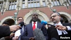 Gambia's Justice Minister Abubacarr Tambadou talks to the media outside the International Court of Justice (ICJ), after the ruling in the case filed by Gambia against Myanmar. REUTERS/Eva Plevier - RC2MLE9JGS4L