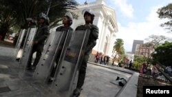 Members of security forces stand guard outside the National Assembly in Caracas, Venezuela, May 7, 2019.