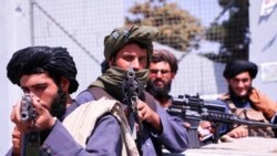Taliban forces stand guard in front of Hamid Karzai International Airport in Kabul, Afghanistan, September 2, 2021.