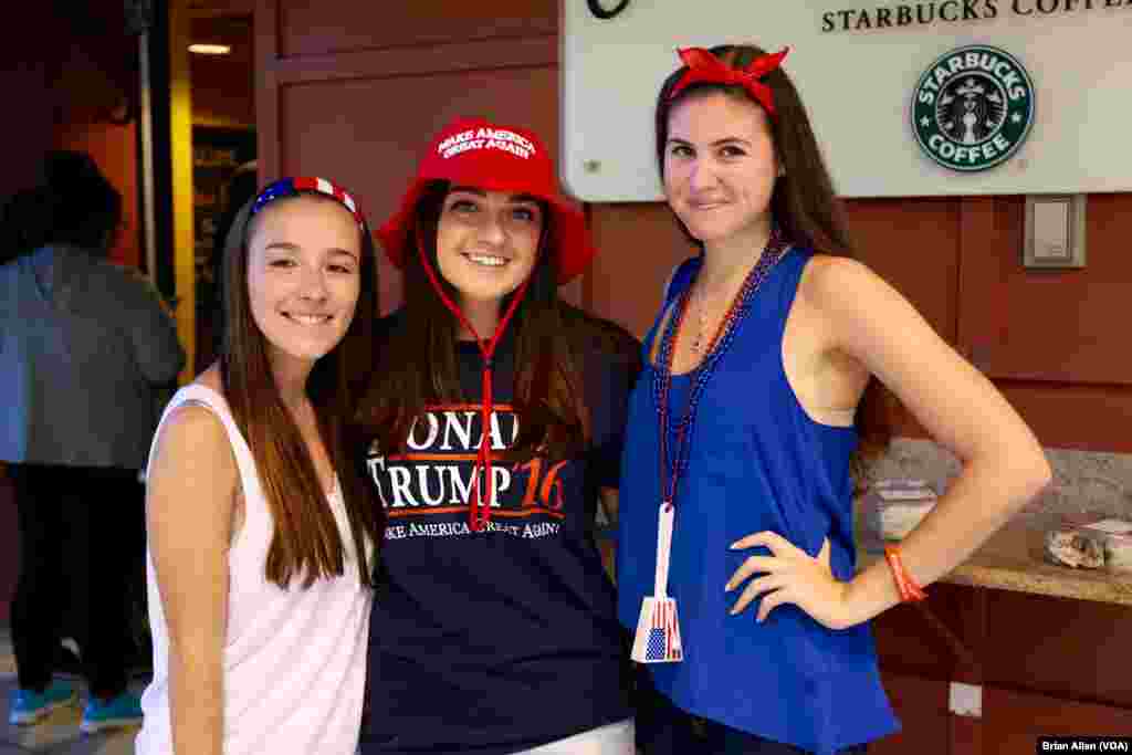 Three Donald Trump supporters, students at Hofstra University, pose for a photo in the dining hall ahead of Monday's presidential debate on campus. (B. Allen/VOA)