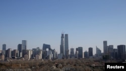 FILE - Buildings are seen against blue sky after the wind dispelled dangerously high levels of air pollution in Beijing, China, December 22, 2016. (REUTERS/Jason Lee/File Photo)