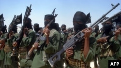 FILE - Islamist fighters loyal to al-Shabab perform military drills at a village in the Lower Shabelle region, 25 kilometers outside Mogadishu, Feb. 17, 2011. 