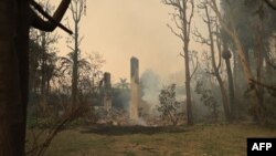 Only a chimney is left standing after the Franklin Fire destroyed the house around it on Dec. 10, 2024, near Malibu, California.