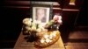 A portrait and flowers in memory of actor Philip Seymour Hoffman is displayed outside Philip Marie Restaurant and bar on Hudson Street in Manhattan, New York, Feb. 2, 2014.