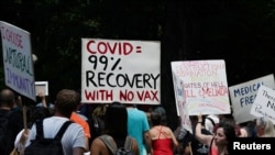 FILE - People gather for an anti-vaccine rally, amid the coronavirus pandemic, in Central Park, New York City, July 24, 2021.