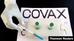 FILE PHOTO: Nurse prepares to administer the AstraZeneca/Oxford vaccine against the COVID-19 at the Eka Kotebe General Hospital in Addis Ababa