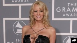 FILE - Stephanie Clifford, known as Stormy Daniels, arrives for the 49th Annual Grammy Awards in Los Angeles, Feb. 11, 2007.